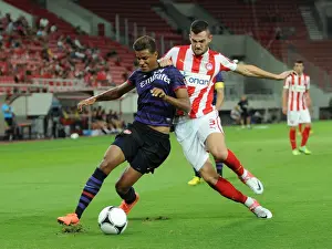 Olympiacos U19 V Arsenal U19 - NextGen 2012:13 Prints: Clash in Piraeus: Angha vs. Lykogiannis in Olympiacos U19 vs