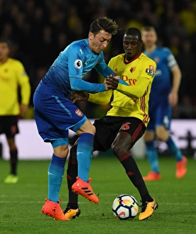 Watford V Arsenal 2017-18 Prints: Clash on the Pitch: Ozil vs. Doucoure - Watford vs. Arsenal, Premier League 2017-18
