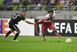 Images Dated 4th October 2018: Clash of Players: Alex Iwobi vs. Maksim Medvedev in Qarabag vs. Arsenal Europa League Match