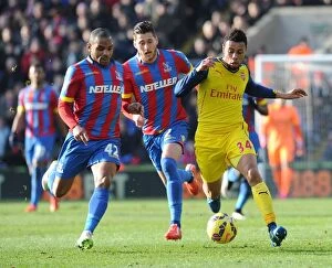 Images Dated 21st February 2015: Clash at Selhurst Park: Coquelin vs. Ward and Puncheon in Arsenal's Premier League Battle