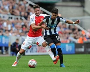 Images Dated 29th August 2015: Clash at St. James Park: A Battle Between Olivier Giroud and Ayoze Perez