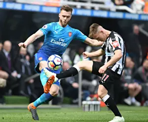 Newcastle United V Arsenal 2017-18 Prints: Clash at St. James Park: Chambers vs Ritchie in Intense Newcastle-Arsenal Battle