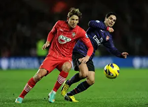 Clash at St. Mary's: Mikel Arteta Stifles Gaston Ramirez's Threat (Southampton v Arsenal, Premier League 2012-13)