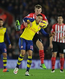Southampton v Arsenal 2014-15 Collection: Clash at St. Mary's: Oxlade-Chamberlain vs. Ward-Prowse in Southampton v Arsenal (2014-15)