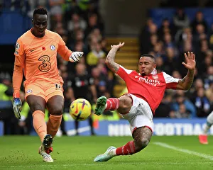 Clash at Stamford Bridge: Arsenal's Gabriel Jesus Harasses Chelsea's Edouard Mendy in Premier League Showdown (2022-23)