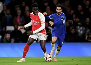 Chelsea V Arsenal 2023-24 Prints: Clash at Stamford Bridge: Arsenal's Bukayo Saka Faces Off Against Chelsea's Marc Cucurella (2023-24)