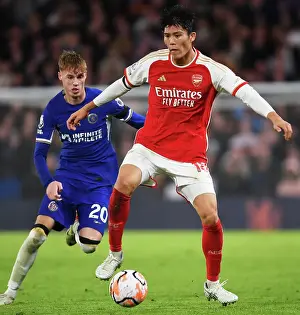 Chelsea V Arsenal 2023-24 Prints: Clash at Stamford Bridge: Arsenal's Tomiyasu Fends Off Chelsea's Palmer (2023-24)