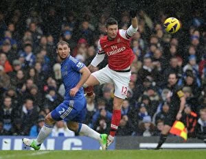 Chelsea v Arsenal 2012-13 Collection: Clash at Stamford Bridge: Giroud vs. Ivanovic
