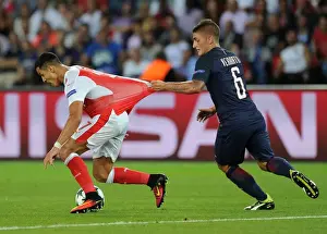 Paris Saint Gernain V Arsenal 2016-17 Prints: Clash of Stars: Alexis Sanchez and Marco Verratti Lock Horns in Tense PSG vs Arsenal Champions League Showdown