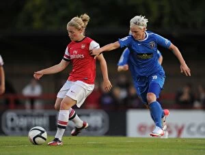 Images Dated 30th August 2012: Clash of Stars: Kim Little vs. Jess Fishlock - A Football Rivalry Unfolds