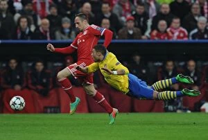 Images Dated 11th March 2014: Clash of Stars: Oxlade-Chamberlain vs. Ribery - Bayern Munich vs. Arsenal, UEFA Champions League