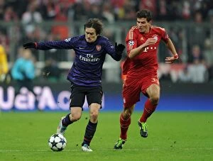 Bayern Munich Collection: Clash of Stars: Rosicky vs. Gomez in Bayern Munich vs. Arsenal UEFA Champions League Showdown