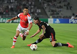 Besiktas V Arsenal 2014-15 Prints: Clash of Stars: Sanchez vs. Gulum in Arsenal's UEFA Champions League Battle against Besiktas