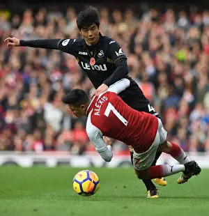 Arsenal V Swansea City 2017-18 Prints: Clash of Stars: Sanchez vs. Ki - Arsenal's Battle against Swansea City