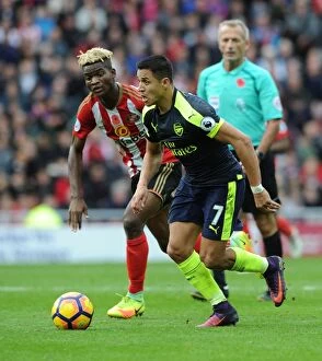 Sunderland v Arsenal 2016-17 Collection: Clash of Stars: Sanchez vs. Ndong in Sunderland v Arsenal Premier League Showdown