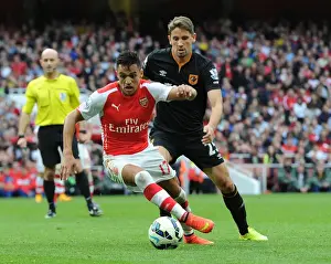 Arsenal V Hull City 2014-15 Prints: Clash of Stars: Sanchez vs. Ramirez in Arsenal's Battle Against Hull City