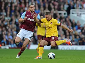 West Ham United V Arsenal 2012-13 Prints: Clash of the Strikers: Podolski vs. Carroll - A Premier League Face-Off