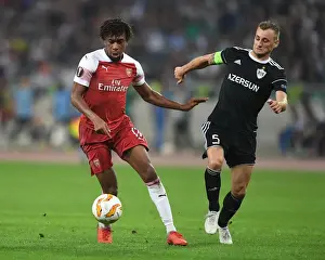 Qarabag V Arsenal 2018-19 Prints: Clash of Styles: Alex Iwobi vs Maksim Medvedev in UEFA Europa League Showdown between Qarabag and Arsenal
