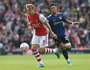 Arsenal v Manchester United 2021-22 Collection: Clash of Talents: Arsenal's Odegaard vs. Man Utd's Sancho in the Premier League Showdown