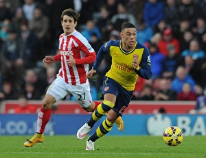 Stoke City V Arsenal 2014-15 Prints: Clash of Talents: Oxlade-Chamberlain vs. Bojan at Stoke City vs. Arsenal (2014-15)