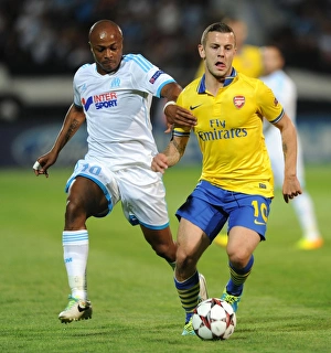 Marseille V Arsenal 2013-14 Prints: Clash of Talents: Wilshere vs. Ayew - Marseille vs. Arsenal, UEFA Champions League, 2013