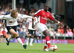 Fulham v Arsenal 2008-09 Collection: Clash of Teammates: Eboue vs. Bullard in Fulham's 1-0 Win over Arsenal, Premier League 2008