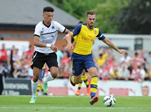 Boreham Wood V Arsenal Prints: Clash of the Titans: Aaron Ramsey vs Lee Angol in Arsenal's Pre-Season Battle at Boreham Wood
