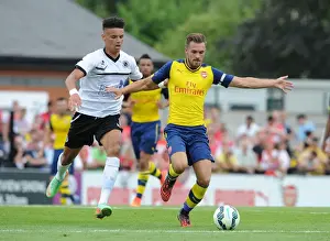 Boreham Wood V Arsenal Prints: Clash of the Titans: Aaron Ramsey vs Lee Angol - Arsenal's Pre-Season Showdown with Boreham Wood