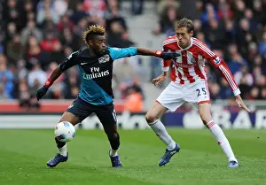 Stoke City V Arsenal 2011-12 Prints: Clash of Titans: Alex Song vs. Peter Crouch - Stoke City vs. Arsenal, Premier League, 2012