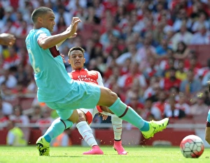 Arsenal V West Ham United 2015-16 Prints: Clash of Titans: Alexis Sanchez vs. Winston Reid in Intense Arsenal-West Ham Battle