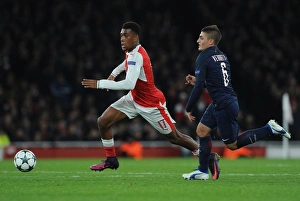 Arsenal V Paris Saint-Germain 2016-17 Prints: Clash of Titans: Arsenal vs. Paris Saint-Germain in the UEFA Champions League (2016-17) - Battle of Wits: Iwobi vs