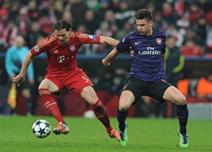 Bayern Munich V Arsenal 2012-13 Prints: Clash of Titans: Giroud vs. Van Buyten - Arsenal vs