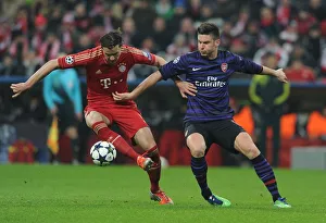 Bayern Munich V Arsenal 2012-13 Prints: Clash of Titans: Giroud vs. Van Buyten - Arsenal vs