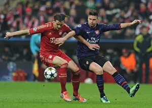 Bayern Munich V Arsenal 2012-13 Prints: Clash of Titans: Giroud vs. Van Buyten - Arsenal vs