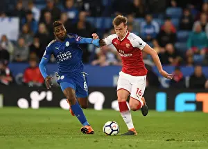 Leicester City V Arsenal 2017-18 Prints: Clash of Titans: Holding vs Iheanacho - A Battle for Premier League Supremacy (Arsenal vs Leicester City 2017-18)