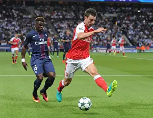 Paris Saint Gernain V Arsenal 2016-17 Prints: Clash of Titans: Koscielny vs. Aurier - Paris Saint-Germain vs. Arsenal UCL Showdown