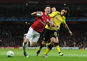 Arsenal V Borussia Dortmund 2011-12 Prints: Clash of Titans: Koscielny vs. Hummels - Arsenal vs