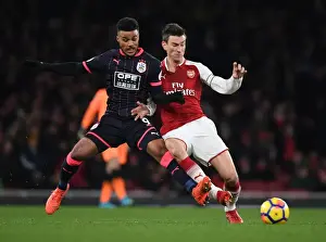 Arsenal V Huddersfield Town 2017-18 Prints: Clash of Titans: Koscielny vs. Kachunga - Arsenal's Premier League Showdown