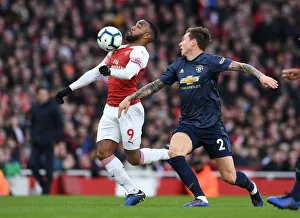Arsenal V Manchester United 2018-19 Prints: Clash of Titans: Lacazette vs. Lindelof - Arsenal vs. Manchester United (2018-19)