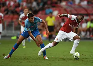 Arsenal V Atletico Madrid 2018-19 Prints: Clash of the Titans: Lacazette vs. Rodriguez - Arsenal vs. Atletico Madrid ICC 2018