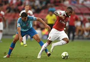 Arsenal V Atletico Madrid 2018-19 Prints: Clash of Titans: Lacazette vs Rodriguez - Arsenal vs Atletico Madrid