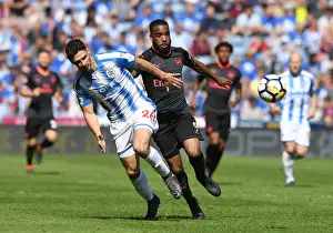 Clash of Titans: Lacazette vs. Schindler in Huddersfield Derby