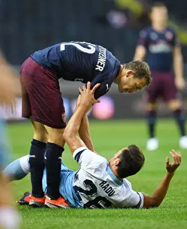 Clash of Titans: Lichtsteiner vs. Radu in Arsenal's Pre-Season Battle with SS Lazio