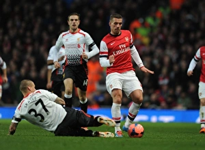 Arsenal V Liverpool - FA Cup 2013-14 Prints: Clash of Titans: Lukas Podolski vs. Martin Skrtel - Arsenal v Liverpool, FA Cup 2013-14