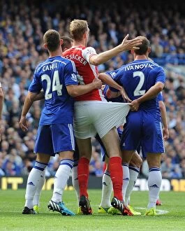 Chelsea v Arsenal 2014-15 Collection: Clash of Titans: Mertesacker vs. Cahill & Ivanovic - Chelsea vs. Arsenal, Premier League 2014-15