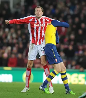 Stoke City V Arsenal 2014-15 Prints: Clash of Titans: Mertesacker vs. Crouch - Stoke City vs. Arsenal, Premier League