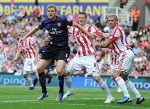 Stoke City V Arsenal 2012-13 Prints: Clash of Titans: Per Mertesacker vs