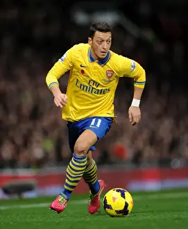 Manchester United V Arsenal 2013-14 Prints: Clash of the Titans: Mesut Ozil Goes Head-to-Head with Manchester United (2013-14)