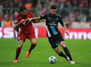 Clash of Titans: Olivier Giroud vs. Javi Martinez - A Battle of Strength and Skill in the UEFA Champions League