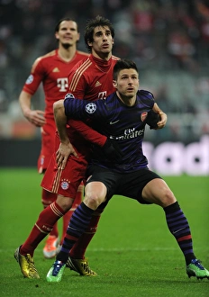 Bayern Munich V Arsenal 2012-13 Prints: Clash of Titans: Olivier Giroud vs